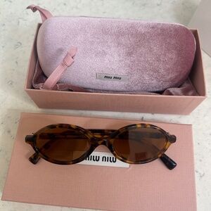 Miumiu oval frame sunglasses